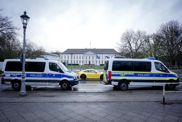 30 March 2026, Berlin: Police cars are parked at Bellevue Palace ahead of the visit of Syria's interim president Ahmed al-Sharaa. Photo: Kay Nietfeld/dpa