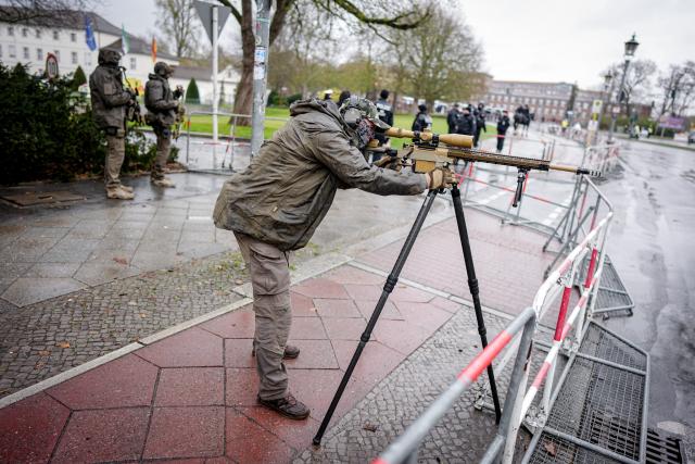 30 March 2026, Berlin: Police snipers secure the visit of Syria's interim president Ahmed al-Sharaa to the Bellevue Palace in Berlin. Photo: Kay Nietfeld/dpa