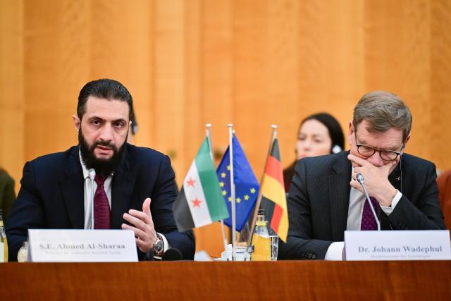 30 March 2026, Berlin: German Foreign Minister Johann Wadephul and Syria's interim president Ahmed al-Sharaa attend a German-Syrian economic roundtable at the Federal Foreign Office in Berlin. Photo: Sebastian Christoph Gollnow/dpa