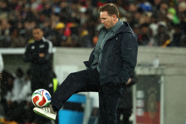30 March 2026, Baden-Wuerttemberg, Stuttgart: Germany head coach Julian Nagelsmann catches a ball on the sidelines during the International Friendly soccer match between Germany and Ghana at MHP Arena. Photo: Christian Charisius/dpa - WICHTIGER HINWEIS: Gemäß den Vorgaben der DFL Deutsche Fußball Liga bzw. des DFB Deutscher Fußball-Bund ist es untersagt, in dem Stadion und/oder vom Spiel angefertigte Fotoaufnahmen in Form von Sequenzbildern und/oder videoähnlichen Fotostrecken zu verwerten bzw. verwerten zu lassen.