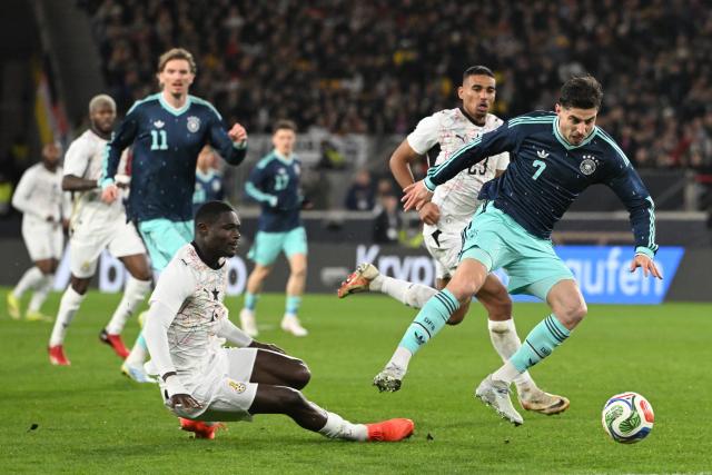 30 March 2026, Baden-Wuerttemberg, Stuttgart: Ghana's Jonas Adjetey and Germany's Kai Havertz (R) battle for the ball during the International Friendly soccer match between Germany and Ghana at MHP Arena. Photo: Federico Gambarini/dpa - WICHTIGER HINWEIS: Gemäß den Vorgaben der DFL Deutsche Fußball Liga bzw. des DFB Deutscher Fußball-Bund ist es untersagt, in dem Stadion und/oder vom Spiel angefertigte Fotoaufnahmen in Form von Sequenzbildern und/oder videoähnlichen Fotostrecken zu verwerten bzw. verwerten zu lassen.