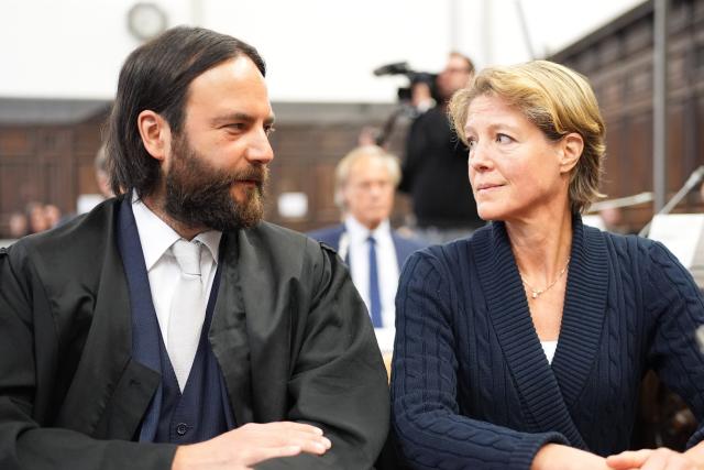 31 March 2026, Hamburg: Christina Block (R), German restaurateur and entrepreneur, and her lawyer Ingo Bott (L), as well as Gerhard Delling (back C), former TV presenter and sports journalist, sit in the courtroom in the trial for alleged child abduction at the Hamburg Regional Court. In a cloak-and-dagger operation on New Year's Eve 2023/24, two children of the gastronomy entrepreneur Block were taken from Denmark to Germany. The trial for the alleged abduction is taking place at Hamburg District Court. Photo: Marcus Brandt/Pool dpa/dpa