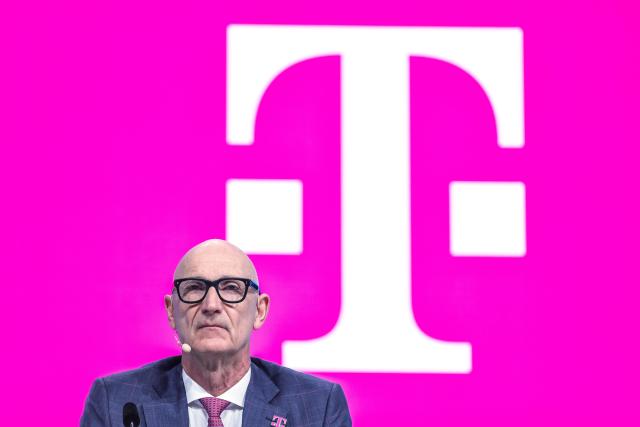 01 April 2026, North Rhine-Westphalia, Bonn: Timotheus Hoettges, CEO of Deutsche Telekom, sits on the podium at the company's shareholders' meeting. Photo: Oliver Berg/dpa