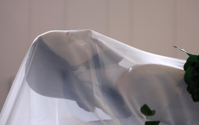 03 April 2026, Bavaria, Lohr am Main: A statue depicting Jesus lying in state is placed in the monastery church of St. Joseph ahead of the Good Friday procession. Photo: Karl-Josef Hildenbrand/dpa