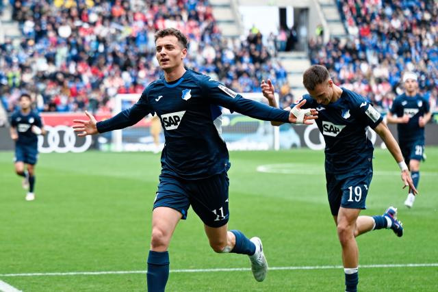 04 April 2026, Baden-Württemberg, Sinsheim: Hoffenheim's Fisnik Asllani (L) celebrates scoring his side's first goal during the German Bundesliga soccer match between TSG 1899 Hoffenheim and FSV Mainz 05 at the PreZero Arena. Photo: Uwe Anspach/dpa - IMPORTANT NOTE: In accordance with the regulations of the DFL German Football League and the DFB German Football Association, it is prohibited to utilize or have utilized photographs taken in the stadium and/or of the match in the form of sequential images and/or video-like photo series.