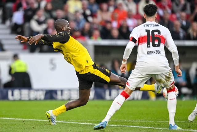 04 April 2026, Baden-Württemberg, Stuttgart: Dortmund's Serhou Guirassy in action against Stuttgart's Atakan Karazor Serhou Guirassy during the German Bundesliga soccer match between VfB Stuttgart and Borussia Dortmund at the MHPArena. Photo: Harry Langer/dpa - IMPORTANT NOTICE: DFL and DFB regulations prohibit any use of photographs as image sequences and/or quasi-video.