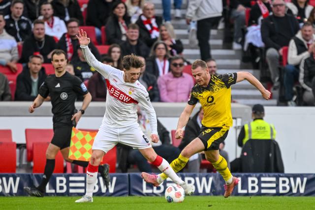 04 April 2026, Baden-Württemberg, Stuttgart: Stuttgart's Angelo Stiller (L) in action against Dortmund's Julian Ryerson during the German Bundesliga soccer match between VfB Stuttgart and Borussia Dortmund at the MHPArena. Photo: Harry Langer/dpa - IMPORTANT NOTE: In accordance with the regulations of the DFL German Football League and the DFB German Football Association, it is prohibited to utilize or have utilized photographs taken in the stadium and/or of the match in the form of sequential images and/or video-like photo series.