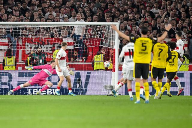 04 April 2026, Baden-Württemberg, Stuttgart: Dortmund's Karim Adeyemi scores his side's first goal during the German Bundesliga soccer match between VfB Stuttgart and Borussia Dortmund at the MHPArena. Photo: Harry Langer/dpa - IMPORTANT NOTICE: DFL and DFB regulations prohibit any use of photographs as image sequences and/or quasi-video.