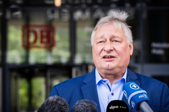 FILED - 23 September 2025, Berlin: Martin Burkert, EVG Chairman and Deputy Chairman of the Supervisory Board of Deutsche Bahn, speaks in front of the Bahntower after the Supervisory Board of Deutsche Bahn confirmed E. Palla as the new head of Deutsche Bahn. Photo: Christoph Soeder/dpa
