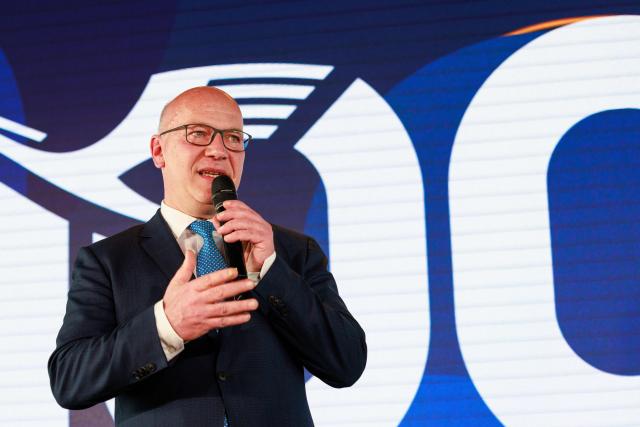 06 April 2026, Brandenburg, Schoenefeld: Kai Wegner, Governing Mayor of Berlin, speaks during a ceremony marking the 100th anniversary of Lufthansa's first flight at Berlin Brandenburg Airport (BER). Photo: Carsten Koall/dpa