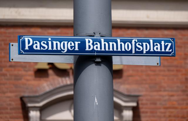 FILED - 10 August 2023, Bavaria, Munich: A sign reading "Pasinger Bahnhofsplatz" stands in front of the Munich-Pasing train station. Photo: Sven Hoppe/dpa
