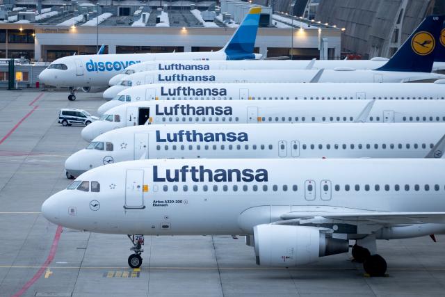 FILED - 12 March 2024, Hessen, Frankfurt/M.: Parked Lufthansa aircraft and one belonging to Discovery Airline are at Frankfurt Airport. Lufthansa cabin crew have been called to strike on Friday, Ufo union says. Photo: Lando Hass/dpa