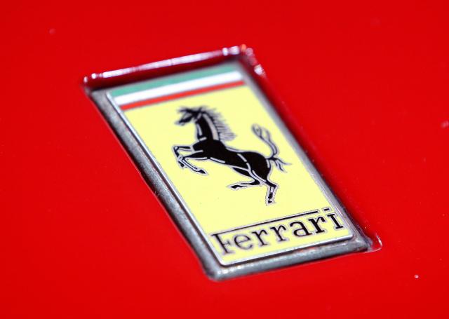 FILED - 23 March 2022, North Rhine-Westphalia, Essen: A view of the Ferrari logo placed on the hood of a vehicle. Photo: Roland Weihrauch/dpa