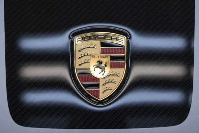 FILED - 06 March 2026, Baden-Württemberg, Stuttgart: The badge is seen on the hood of a Porsche 911 sports car at the Porsche AG production facility in Zuffenhausen. Photo: Marijan Murat/dpa