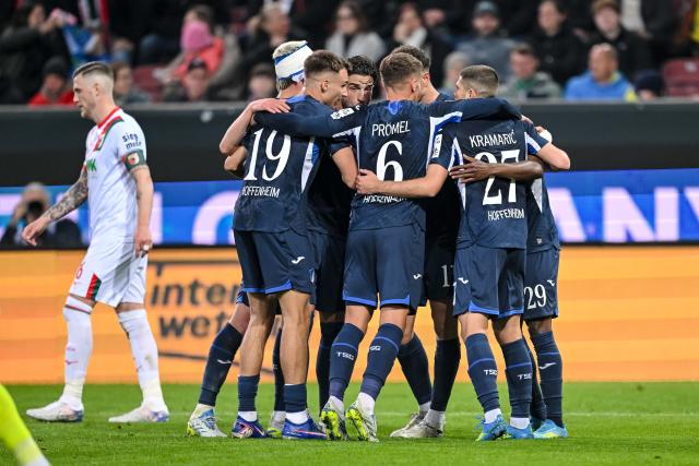 10 April 2026, Bavaria, Augsburg: Hoffenheim's Bazoumana Toure celebrates after scoring his side's second goal of the game during the German Bundesliga soccer match between FC Augsburg and TSG 1899 Hoffenheim at the WWK-Arena. Photo: Harry Langer/dpa - WICHTIGER HINWEIS: Gemäß den Vorgaben der DFL Deutsche Fußball Liga bzw. des DFB Deutscher Fußball-Bund ist es untersagt, in dem Stadion und/oder vom Spiel angefertigte Fotoaufnahmen in Form von Sequenzbildern und/oder videoähnlichen Fotostrecken zu verwerten bzw. verwerten zu lassen.