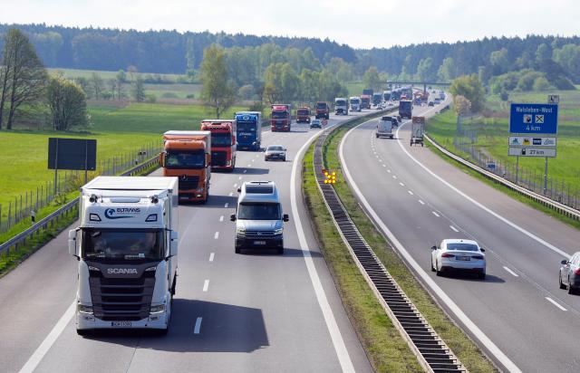 FILED - 17 April 2024, Walsleben: A long line of trucks drives along the A24 highway. Photo: Soeren Stache/dpa