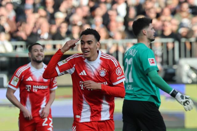 11 April 2026, Hamburg: Bayern Munich's Jamal Musiala celebrates after scoring his side's first goal of the game during the German Bundesliga soccer match between FC St. Pauli and Bayern Munich at Millerntor Stadium. Photo: Christian Charisius/dpa - IMPORTANT NOTICE: DFL and DFB regulations prohibit any use of photographs as image sequences and/or quasi-video.
