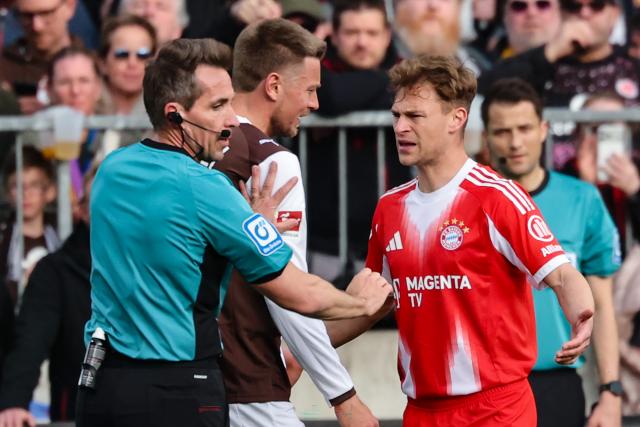 11 April 2026, Hamburg: Bayern Munich's Joshua Kimmich discusses with St. Pauli's Hauke Wahl and referee Tobias Stieler during the German Bundesliga soccer match between FC St. Pauli and Bayern Munich at Millerntor Stadium. Photo: Christian Charisius/dpa - IMPORTANT NOTICE: DFL and DFB regulations prohibit any use of photographs as image sequences and/or quasi-video.