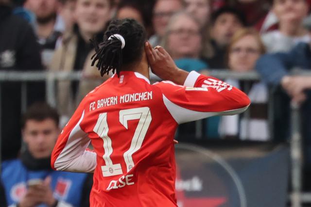11 April 2026, Hamburg: Bayern Munich's Michael Olise celebrates after scoring his side's third goal of the game during the German Bundesliga soccer match between FC St. Pauli and Bayern Munich at Millerntor Stadium. Photo: Christian Charisius/dpa - IMPORTANT NOTICE: DFL and DFB regulations prohibit any use of photographs as image sequences and/or quasi-video.