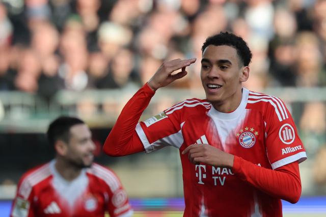 11 April 2026, Hamburg: Bayern Munich's Jamal Musiala celebrates after scoring the his side's first goal of the game during the German Bundesliga soccer match between FC St. Pauli and Bayern Munich at Millerntor Stadium. Photo: Christian Charisius/dpa - IMPORTANT NOTICE: DFL and DFB regulations prohibit any use of photographs as image sequences and/or quasi-video.