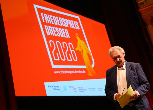 12 April 2026, Saxony, Dresden: Jean Asselborn, former Foreign Minister of Luxembourg, stands on stage after his laudatory speech to the award winner Klementyna Suchanow, women's rights activist from Poland, at the award ceremony for the Dresden Peace Prize 2026 in the Semperoper. Photo: Robert Michael/dpa