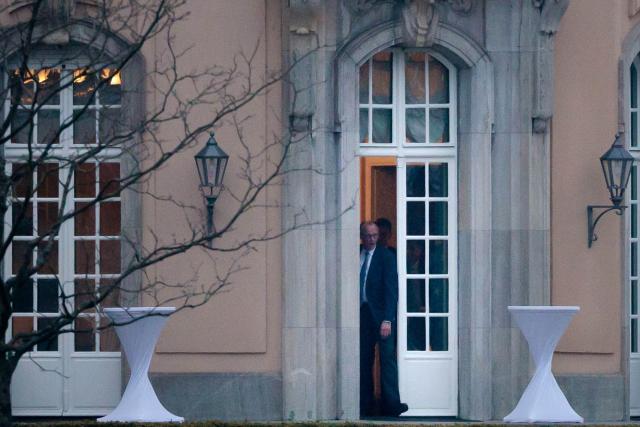 12 April 2026, Berlin: German Chancellor Friedrich Merz steps out the terrace in front of Villa Borsig during discussions among the leaders of the governing coalition regarding relief measures for energy prices and upcoming reforms. Photo: Carsten Koall/dpa