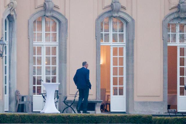 12 April 2026, Berlin: German Chancellor Friedrich Merz walks out onto the terrace in front of Villa Borsig during discussions among the leaders of the governing coalition regarding relief measures for energy prices and upcoming reforms. Photo: Carsten Koall/dpa