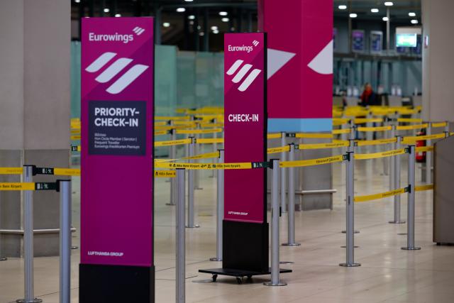 13 April 2026, Hesse, Frankfurt/Main: The check-in desks of the airline Eurowings at Cologne/Bonn Airport are almost deserted. Photo: Hannes P. Albert/dpa