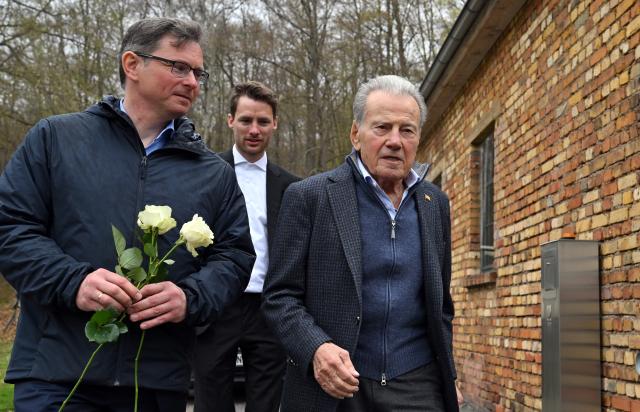 13 April 2026, Thuringia, Nordhausen: Andreas Froese (L), director of the memorial site, and Jerry Wartski (R), survivor of the concentration camp, during the commemoration ceremony at the Mittelbau-Dora concentration camp memorial site on the 81st anniversary of the liberation of the Mittelbau-Dora concentration camp near Nordhausen. In the Mittelbau-Dora concentration camp, which was built in 1943, around 60,000 prisoners were forced to produce rockets and armaments under the most inhumane conditions in a system of tunnels. Many died as a result of forced labor, abuse, hunger and disease. US troops liberated the camp on April 11, 1945. Photo: Martin Schutt/dpa