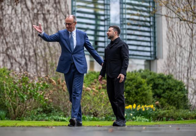 14 April 2026, Berlin: Friedrich Merz (L), Germany's Chancellor, welcomes Volodymyr Zelensky, Ukraine's President, in front of the Federal Chancellery for the first German-Ukrainian government consultations in many years. Photo: Michael Kappeler/dpa