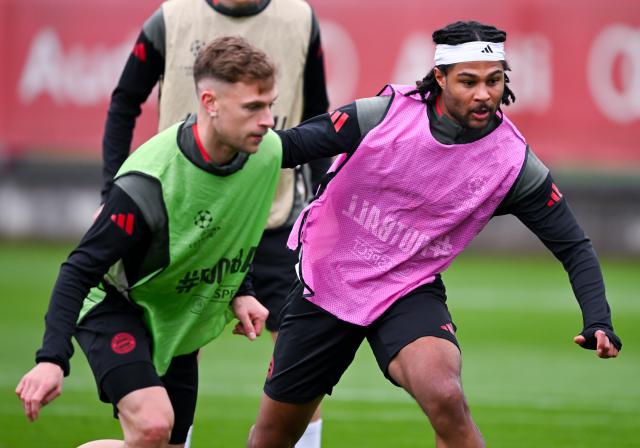 14 April 2026, Bavaria, Munich: Bayern Munich's Joshua Kimmich (L) and Bayern Munich's Serge Gnabry in action duirng a training session at the training facility on Saebener Strasse ahead of Wednesday's UEFA Champions League Quarter-final Second Leg soocer match against Real Madrid. Photo: Sven Hoppe/dpa