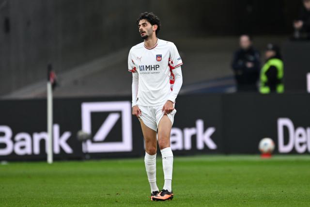 FILED - 14 March 2026, Hesse, Frankfurt/M.: Heidenheim's Eren Dinkci reacts after the final whistle of the German Bundesliga soccer match between Eintracht Frankfurt and 1. FC Heidenheim at the Deutsche Bank Park. Photo: Florian Wiegand/dpa - IMPORTANT NOTE: In accordance with the regulations of the DFL German Football League and the DFB German Football Association, it is prohibited to utilize or have utilized photographs taken in the stadium and/or of the match in the form of sequential images and/or video-like photo series.