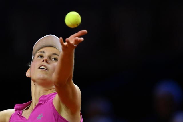 14 April 2026, Baden-Wuerttemberg, Stuttgart: Belgian tennis player Elise Mertens in action against Germany's Ella Seidel during their women's singles round of 32 match of the Stuttgart Open tennis tournament. Photo: Marijan Murat/dpa