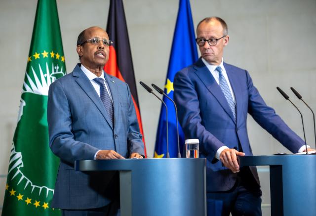 14 April 2026, Berlin: German Chancellor Friedrich Merz (R) and Mahmoud Ali Youssouf, President of the African Union, hold a joint press conference at the Federal Chancellery. Photo: Michael Kappeler/dpa