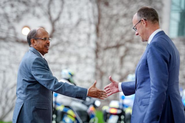 14 April 2026, Berlin: German Chancellor Friedrich Merz (R) receives Mahmoud Ali Youssouf, President of the African Union, in front of the Federal Chancellery. Photo: Kay Nietfeld/dpa