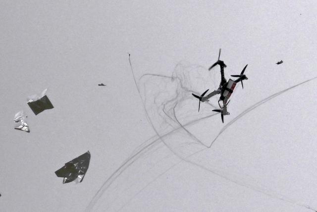 14 April 2026, Brandenburg, Brandenburg an der Havel: A drone is hit by a net and crashes after an interceptor drone (R) hurled a net at it. The newly formed joint venture between Ondas Holdings Inc. and Heidelberger Druckmaschinen, the Onberg autonomous Systems is to bring American-Israeli drone defense technology to Germany for the protection of critical infrastructures and for military applications. Photo: Michael Bahlo/dpa