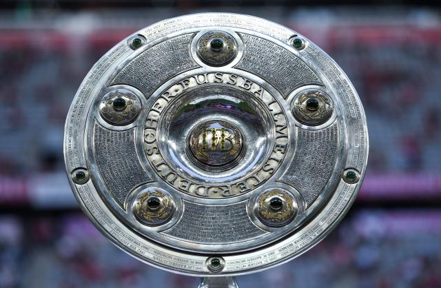 FILED - 26 August 2016, Bavaria, Munich: The Bundesliga championship shield is displayed on the pitch at the Allianz Arena before the season opener between Bayern Munich and Werder Bremen. Photo: picture alliance / dpa