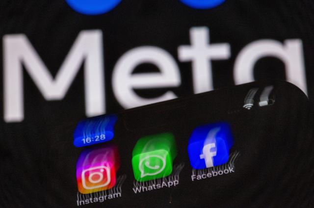 FILED - 16 May 2024, Mecklenburg-Western Pomerania, Schwerin: The Instagram, Facebook, and WhatsApp apps can be seen on a smartphone display in front of the logo of the internet company Meta. Photo: Jens Büttner/dpa