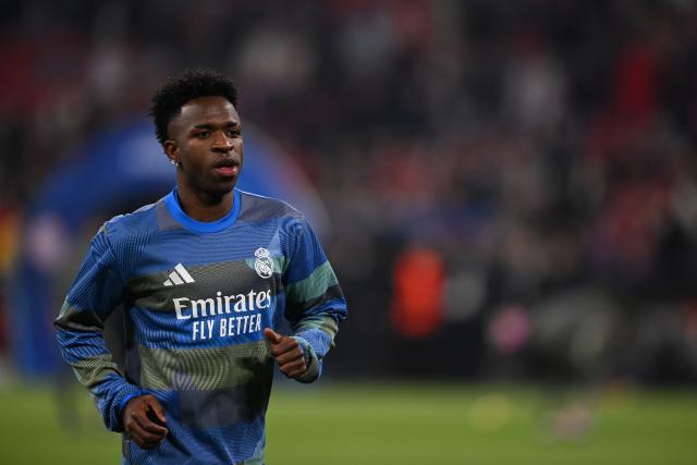 15 April 2026, Bavaria, Munich: Real Madrid's Vinicius Junior warms up prior to the start of the UEFA Champions League Quarterfinal Second Leg soccer match between Bayern Munich and Real Madrid at Allianz Arena. Photo: Sven Hoppe/dpa