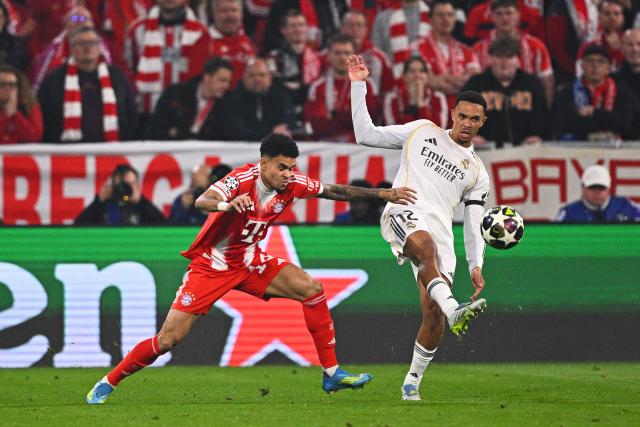 15 April 2026, Bavaria, Munich: Real Madrid's Trent Alexander-Arnold (R) and Bayern Munich's Luis Diaz battle for the ball during the UEFA Champions League Quarterfinal Second Leg soccer match between Bayern Munich and Real Madrid at Allianz Arena. Photo: Tom Weller/dpa