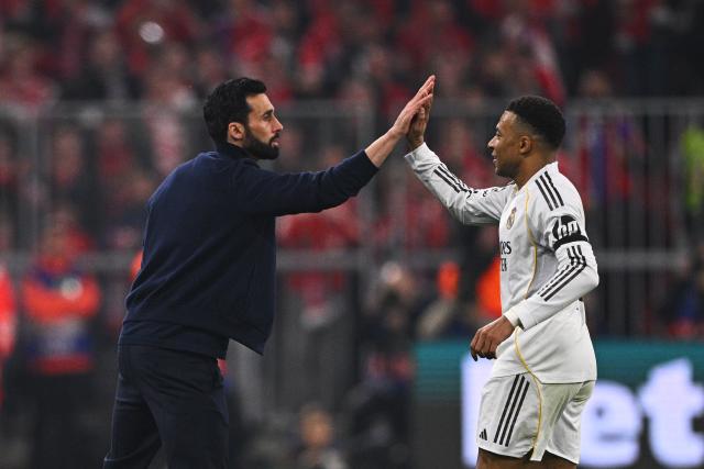 15 April 2026, Bavaria, Munich: Real Madrid's Kylian Mbappe (R) celebrates his side's second goal with coach Alvaro Arbeloa during the UEFA Champions League Quarterfinal Second Leg soccer match between Bayern Munich and Real Madrid at Allianz Arena. Photo: Tom Weller/dpa