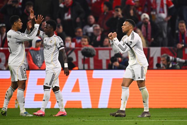 15 April 2026, Bavaria, Munich: Real Madrid's Kylian Mbappe (R) celebrates scoring his side's third goal with teammates during the UEFA Champions League Quarterfinal Second Leg soccer match between Bayern Munich and Real Madrid at Allianz Arena. Photo: Tom Weller/dpa