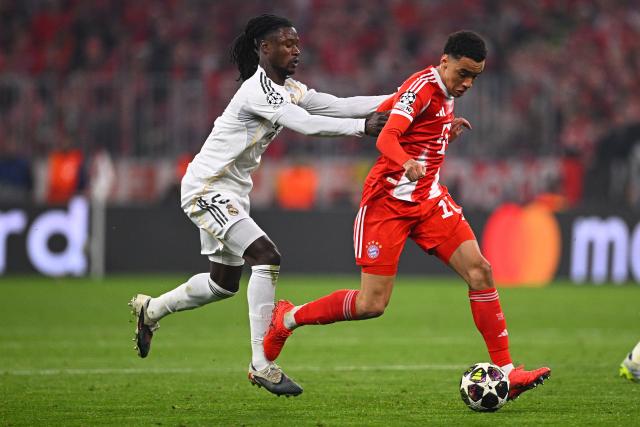 15 April 2026, Bavaria, Munich: Real Madrid's Eduardo Camavinga (L) and Bayern Munich's Jamal Musiala battle for the ball during the UEFA Champions League Quarterfinal Second Leg soccer match between Bayern Munich and Real Madrid at Allianz Arena. Photo: Tom Weller/dpa