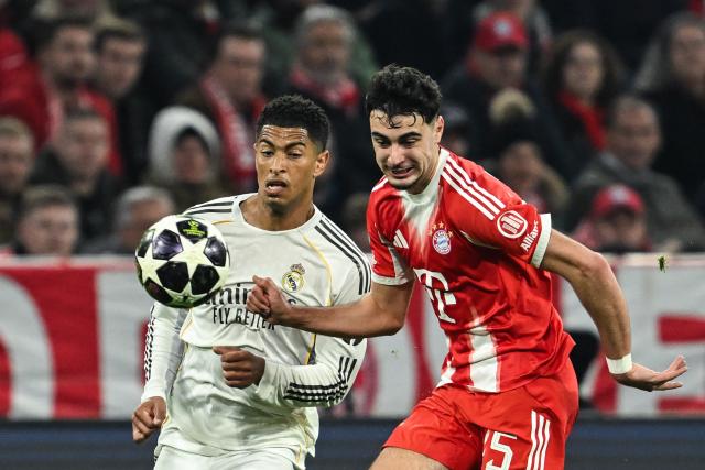 15 April 2026, Bavaria, Munich: Real Madrid's Jude Bellingham (L) and Bayern Munich's Aleksandar Pavlovic battle for the ball during the UEFA Champions League Quarterfinal Second Leg soccer match between Bayern Munich and Real Madrid at Allianz Arena. Photo: Sven Hoppe/dpa