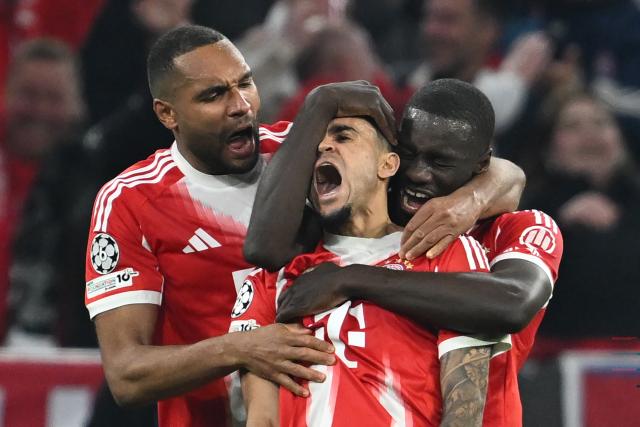15 April 2026, Bavaria, Munich: Bayern Munich's Luis Diaz celebrates scoring his side's third goal with teammates Dayot Upamecano (R) and Jonathan Tah (L) during the UEFA Champions League Quarterfinal Second Leg soccer match between Bayern Munich and Real Madrid at Allianz Arena. Photo: Sven Hoppe/dpa