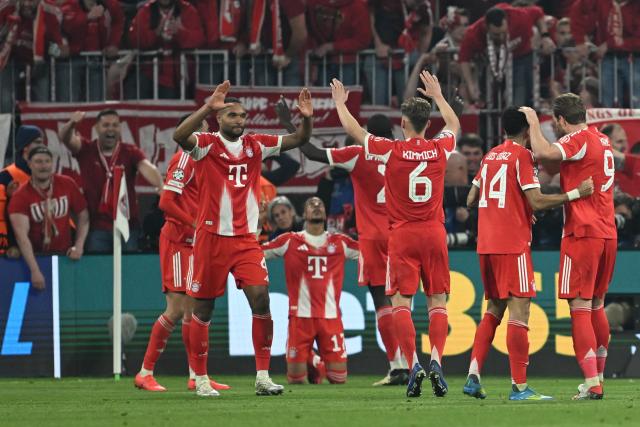 15 April 2026, Bavaria, Munich: Bayern Munich's Michael Olise (C) celebrates scoring his side's fourth goal with teammates during the UEFA Champions League Quarterfinal Second Leg soccer match between Bayern Munich and Real Madrid at Allianz Arena. Photo: Sven Hoppe/dpa