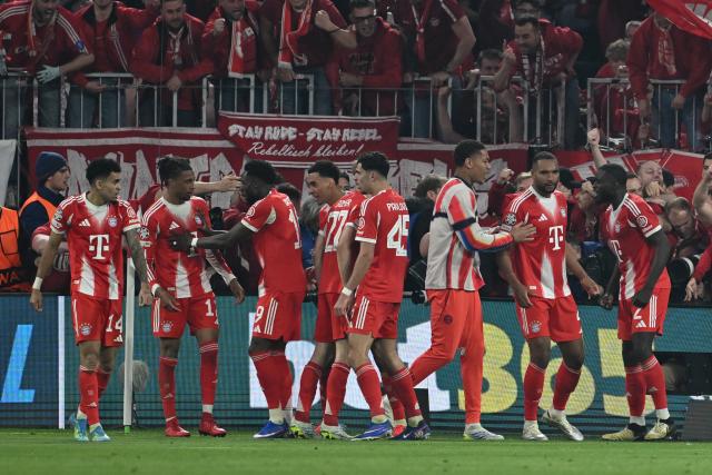15 April 2026, Bavaria, Munich: Bayern Munich's Michael Olise (2nd L) celebrates scoring his side's fourth goal with teammates during the UEFA Champions League Quarterfinal Second Leg soccer match between Bayern Munich and Real Madrid at Allianz Arena. Photo: Sven Hoppe/dpa
