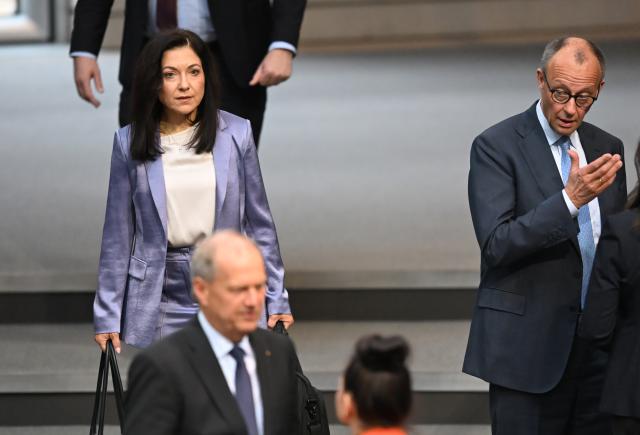 16 April 2026, Berlin: Germany's Chancellor Friedrich Merz (2nd R) and Germany's Minister for Economic Affairs and Energy Katherina Reiche (L) attend a plenary session of the German Bundestag, where the agenda includes the first reading of a bill to reduce energy taxes. Photo: Markus Lenhardt/dpa