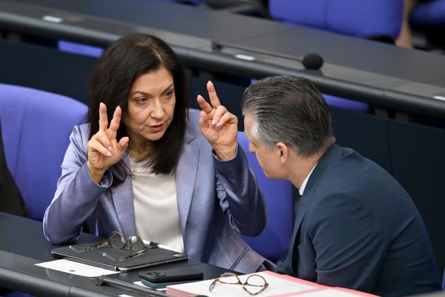 16 April 2026, Berlin: Katherina Reiche (L), Germany's Minister for Economic Affairs and Energy, speaks in the plenary chamber of the German Bundestag with Thorsten Frei (R), Head of the Federal Chancellery and Minister for Special Tasks. A bill introduced by the coalition factions to reduce energy taxes is being debated in the Bundestag. Photo: Markus Lenhardt/dpa