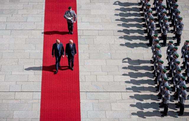 16 April 2026, Berlin: Friedrich Merz (L), Germany's Chancellor, welcomes Micheal Martin, Ireland's Prime Minister, with military honors in front of the Federal Chancellery. Ireland will assume the EU Council Presidency in the second half of 2026. Photo: Michael Kappeler/dpa
